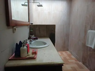 a bathroom with a sink and a mirror at Villa Kora in Seminyak