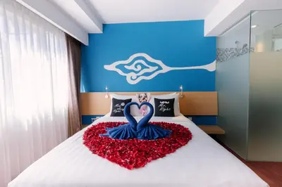 a bed with a heart made out of flowers at Kuta Beach Hotel in Kuta