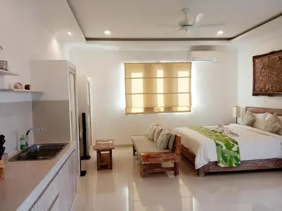 a bedroom with a bed and a sink at ★ VIP ★ Green Studio Apartment in Seminyak, No.23 in Seminyak