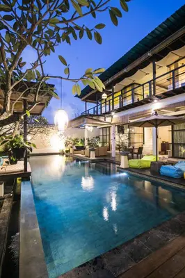 an infinity pool in a villa at night at Sunset Paradise at Temple Hill Jimbaran in Jimbaran