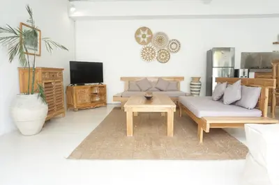 a living room with a couch and a coffee table at Villa Pagu in Seminyak