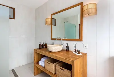 a bathroom with a sink and a mirror at Unicorn Shelter Villa in Seminyak