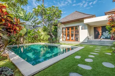 a swimming pool in the yard of a villa at Villa Essence in Seminyak