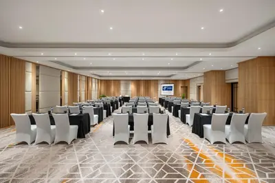a conference room with rows of chairs and a screen at Holiday Inn Express Bali Sunset Road by IHG in Kuta