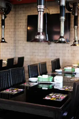 a table with chairs and plates on top of it at 100 Sunset Kuta Hotel & Ballroom in Kuta
