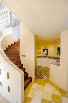 a staircase leading up to a kitchen in a house at Space Villas Bali in Seminyak