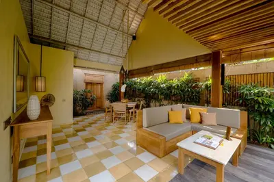 a living room with a couch and a table at Space Villas Bali in Seminyak