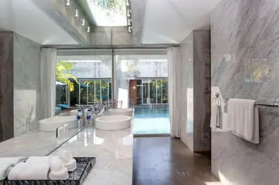 a bathroom with two sinks and a tub at Villa C88 Seminyak in Seminyak