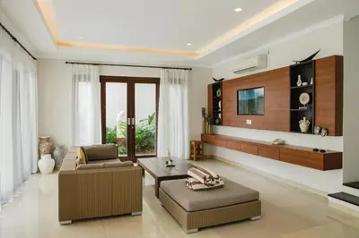a living room with a couch and a table at White Lotus Villas Seminyak in Seminyak