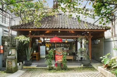 a gazebo with a sign that says the hours at White Lotus Villas Seminyak in Seminyak