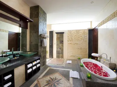a bathroom with a large tub and a sink at Villa LeGa in Seminyak