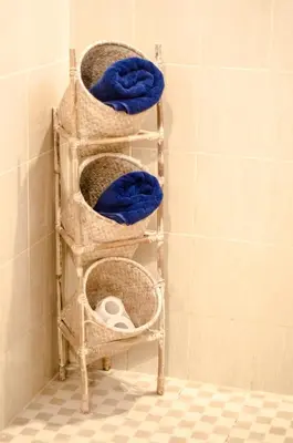 a towel rack in a shower with blue towels at Villa Salya - 3BR - Private Pool - 1min walk to La Favela! in Seminyak