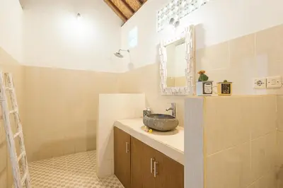 a bathroom with a sink and a mirror at Villa Salya - 3BR - Private Pool - 1min walk to La Favela! in Seminyak