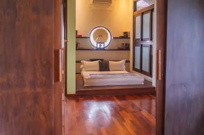 a bedroom with a bed in the middle of a room at Villa Nara - Your Unique & Private Villa in Seminyak Petitenget in Seminyak