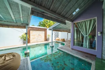 a swimming pool in a villa with a house at Villa West - Charming 2 bdr villa in Oberoi - PERFECT LOCATION! in Seminyak