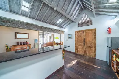 a kitchen and living room with a barn door at Villa West - Charming 2 bdr villa in Oberoi - PERFECT LOCATION! in Seminyak