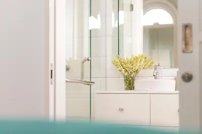 a bathroom with a sink and a mirror at Villa Neno in Seminyak