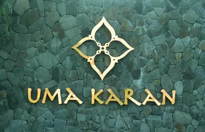a sign that reads unagi karavan on a green background at Uma Karan in Seminyak