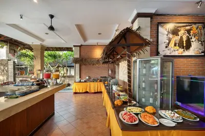 a kitchen with plates of food on a counter at Legian Village Hotel - CHSE Certified in Legian