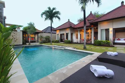 a swimming pool in the backyard of a villa at RC Villas and Spa Bali in Seminyak