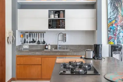 a kitchen with a sink and a stove top oven at Villa Sawah - 3bd in Seminyak Center in Seminyak