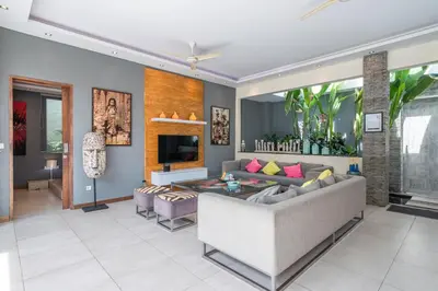 a living room with a couch and a table at Villa Sawah - 3bd in Seminyak Center in Seminyak