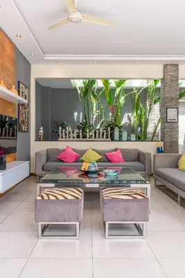 a living room with a couch and a table at Villa Sawah - 3bd in Seminyak Center in Seminyak