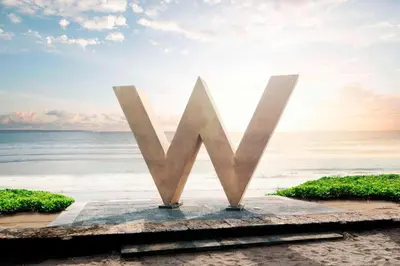 a monument on the beach with the ocean in the background at W Bali - Seminyak in Seminyak
