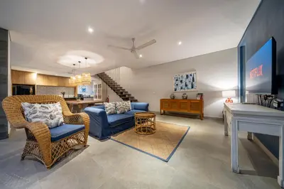 a living room with two chairs and a couch at Villa Jekumah 2 in Seminyak