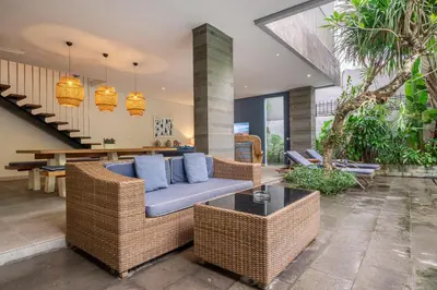a living room with a couch and a table at Villa Jekumah 2 in Seminyak