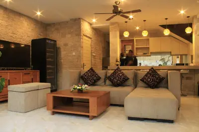 a living room with a couch and a coffee table at Villa Margaux in Seminyak