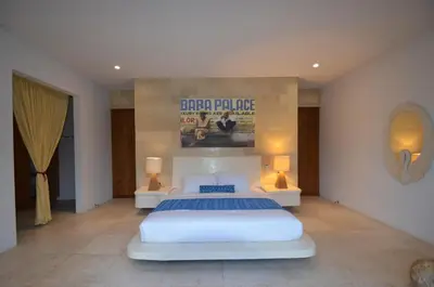 a bedroom with a bed and a poster on the wall at Elegant Villa Casabianca - Tropical Pool & Garden, Near Potato Head Beach Club! in Seminyak