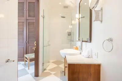 a bathroom with a sink and a mirror at Villa CJ Seminyak in Seminyak