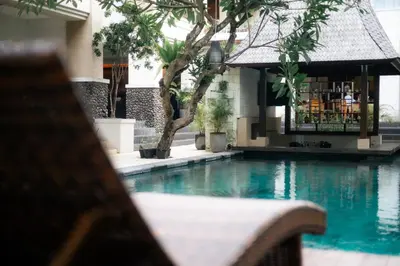 a view of a swimming pool in a building at Fourteen Roses Beach Hotel in Legian