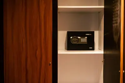 a room with a shelf with a radio on it at Fourteen Roses Beach Hotel in Legian