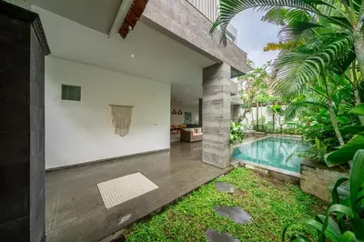 an external view of a house with a swimming pool at Villa Jekumah 3 in Seminyak