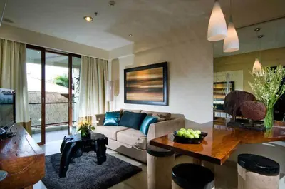 a living room with a couch and a table at Kuta Luxury Residence in Kuta