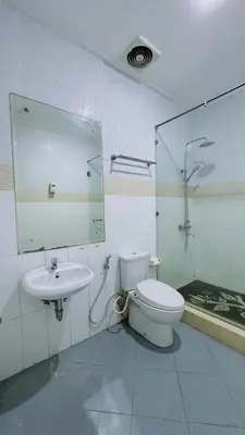 a bathroom with a toilet and a sink at Dedy Beach Inn in Kuta