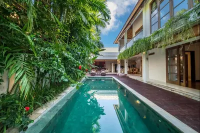 a swimming pool in the courtyard of a villa at Villa Lagoon Canggu in Canggu