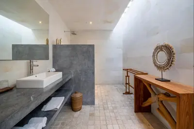 a bathroom with a sink and a bath tub at Villa Lagoon Canggu in Canggu