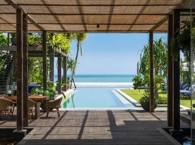 a view from the patio of a resort with a swimming pool at Noku Beach House by Elite Havens in Seminyak