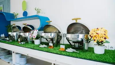 a counter with severalousandousandousandousandousandousandousandousandousandousandousandousand at POP! Hotel Kuta Beach in Kuta