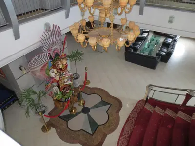 an overhead view of a living room with a chandelier at Bali Paradise City Hotel in Denpasar