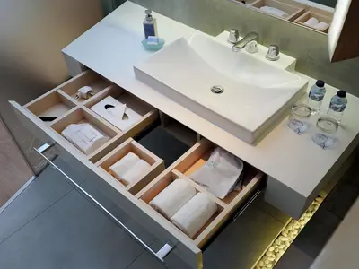 a bathroom with a sink and a counter with towels at IZE Seminyak by LifestyleRetreats in Seminyak