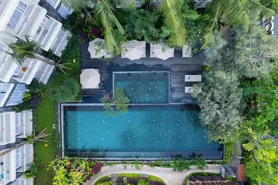 an overhead view of a swimming pool in a building at THE 1O1 Bali Fontana Seminyak in Legian