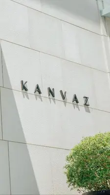 a sign on the side of a building at Kanvaz Village Resort Seminyak in Seminyak