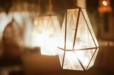 aendant light hanging from a ceiling with lights at Oma Villa - A tropical sanctuary of Seminyak in Seminyak