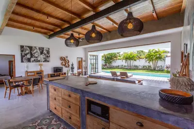 an open living room with a large island in a villa at Villa Maje by Alfred in Bali in Seminyak