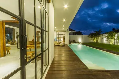 a house with a swimming pool in the backyard at Villa Maje by Alfred in Bali in Seminyak