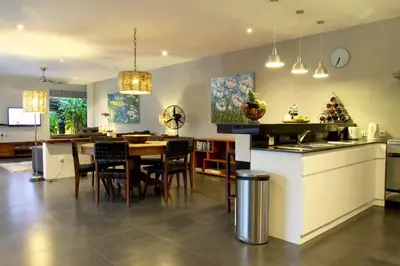 a kitchen and dining room with a table and chairs at Anyar Estate in Canggu
